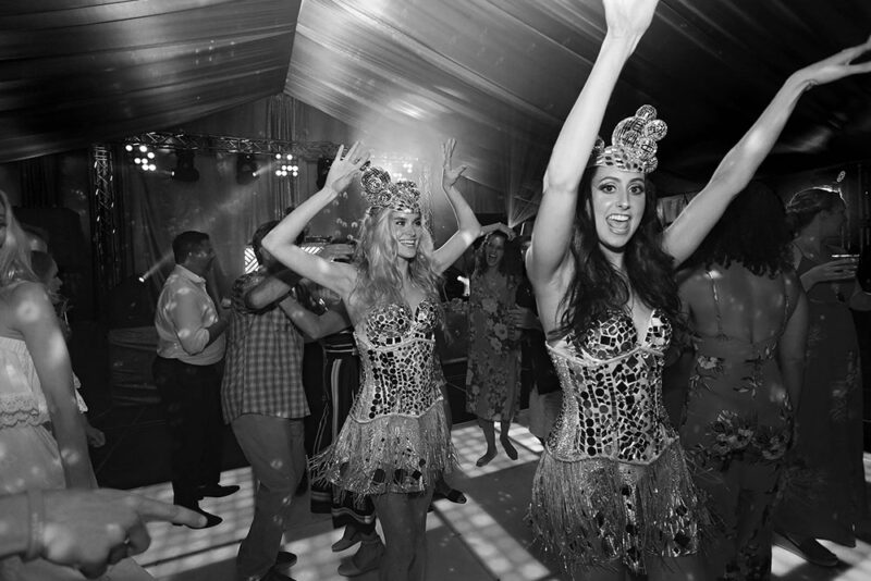 Dancers in silver corsets rocking up the party