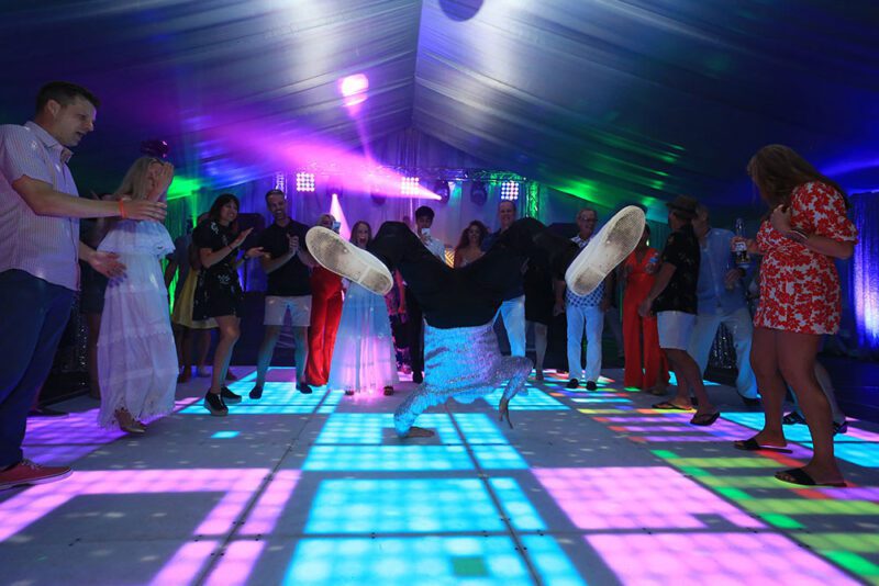 Break dancer on LED dance floor