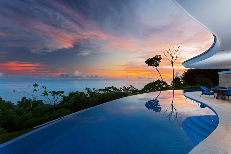 Infinity pool enhanced by majestic sunset - Casa de Luz | Costa Verde Estates