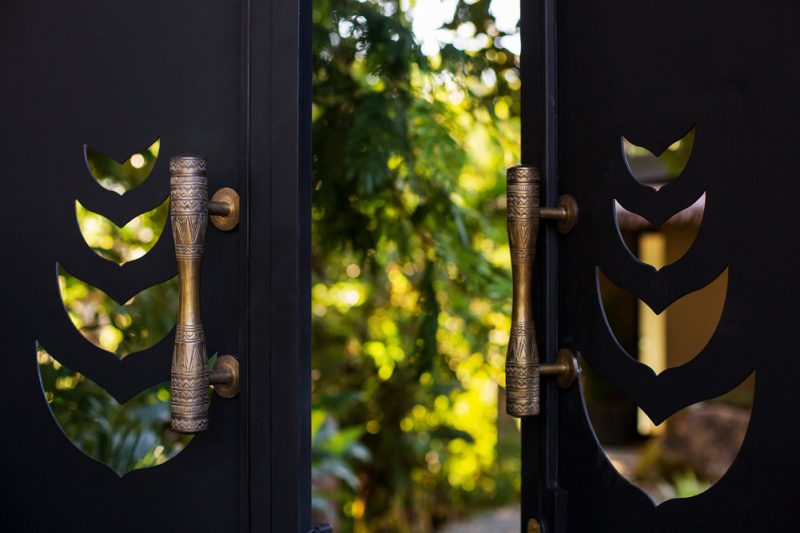 The balinese doorknob finishings and the idea of every gate being a threshold to either a fairy forest or a secret garden creates a sense of anticipation and excitement, making the entire experience truly magical. - Casa Citrina | MU Estate