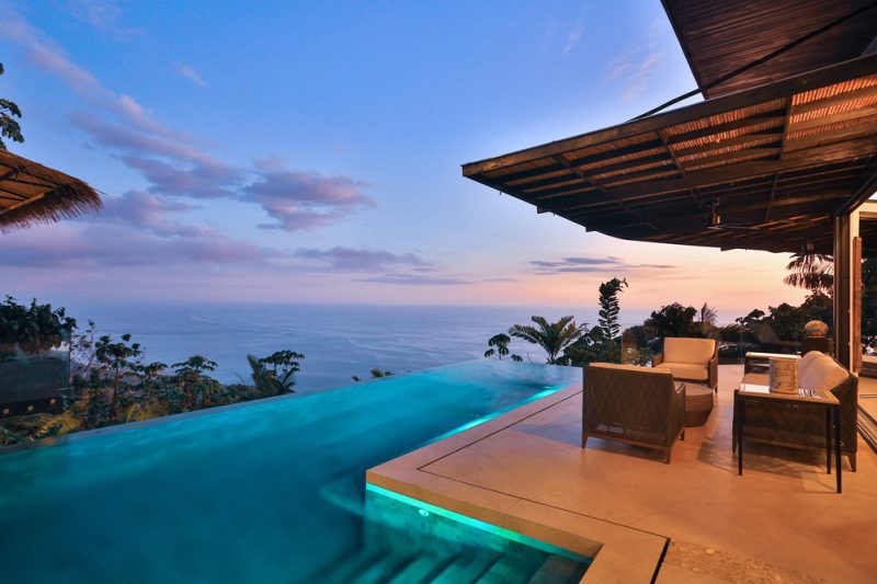 An infinity pool that merges into the horizon, ocean or sky. This design feature gives the impression that the water is flowing seamlessly and also creates the illusion of being floating into the landscape. - Casa Citrina | MU Estate